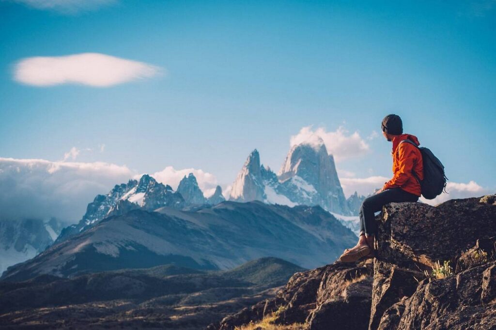 Mountain trekking. Man looking the mountains 